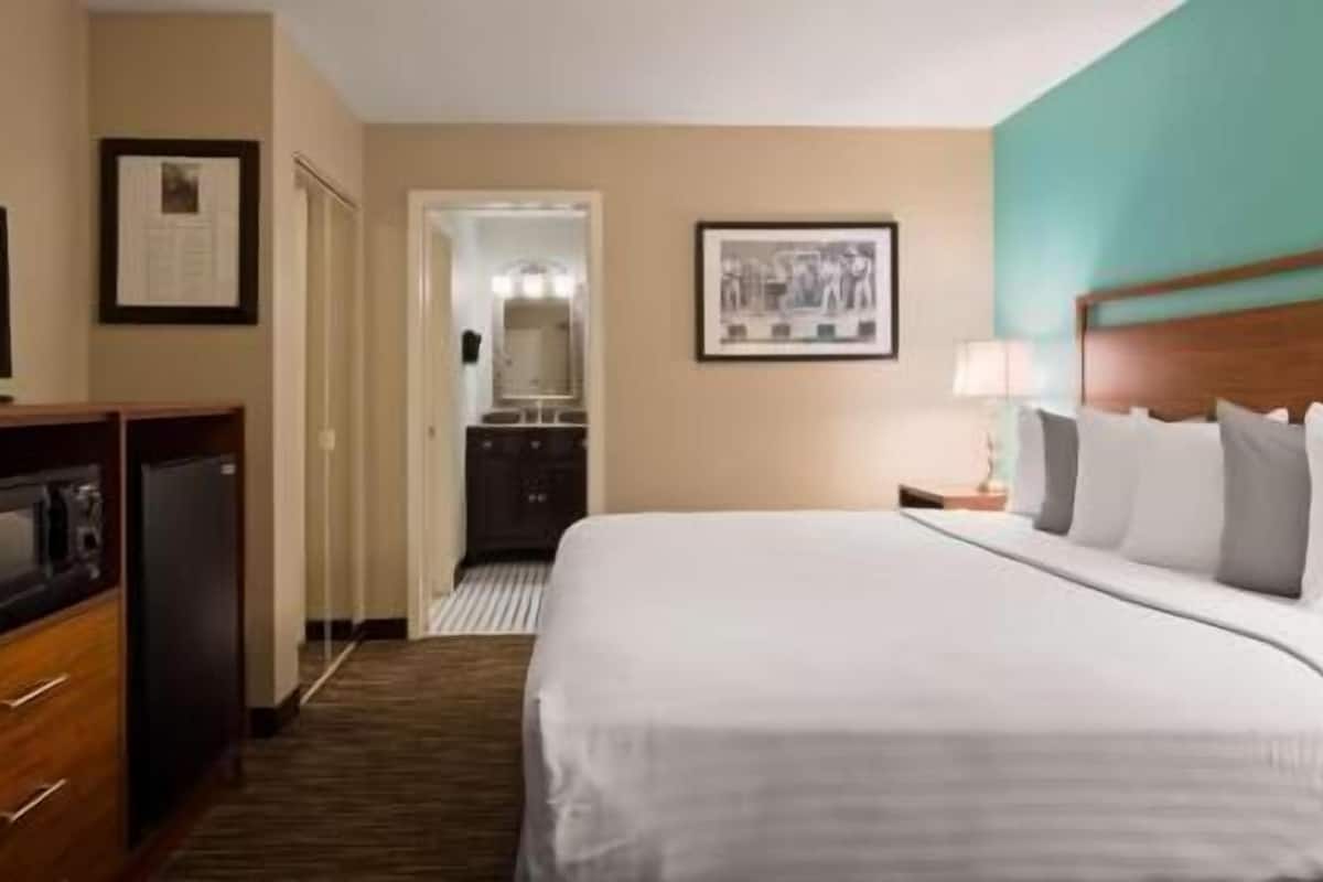 Individually decorated, desk, blackout drapes, iron/ironing board