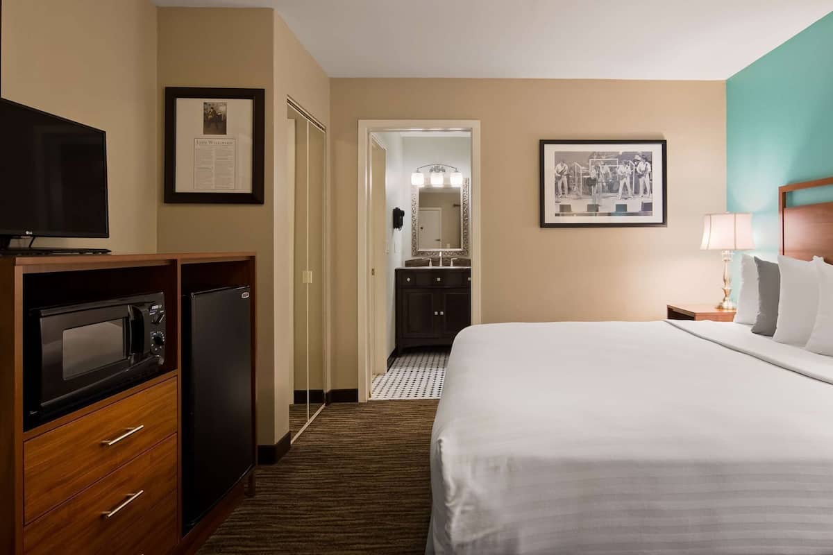 Individually decorated, desk, blackout drapes, iron/ironing board