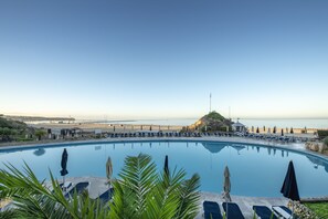 Outdoor pool, open 9:00 AM to 7:00 PM, pool umbrellas, sun loungers