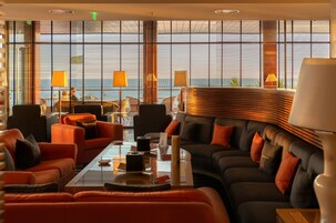 3 bars/lounges, poolside bar, beach bar