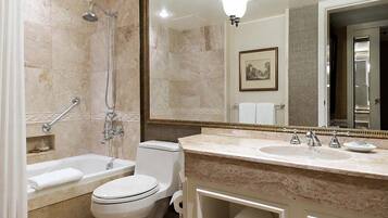 A bathroom with a bathtub, toilet, and sink, all in white.
