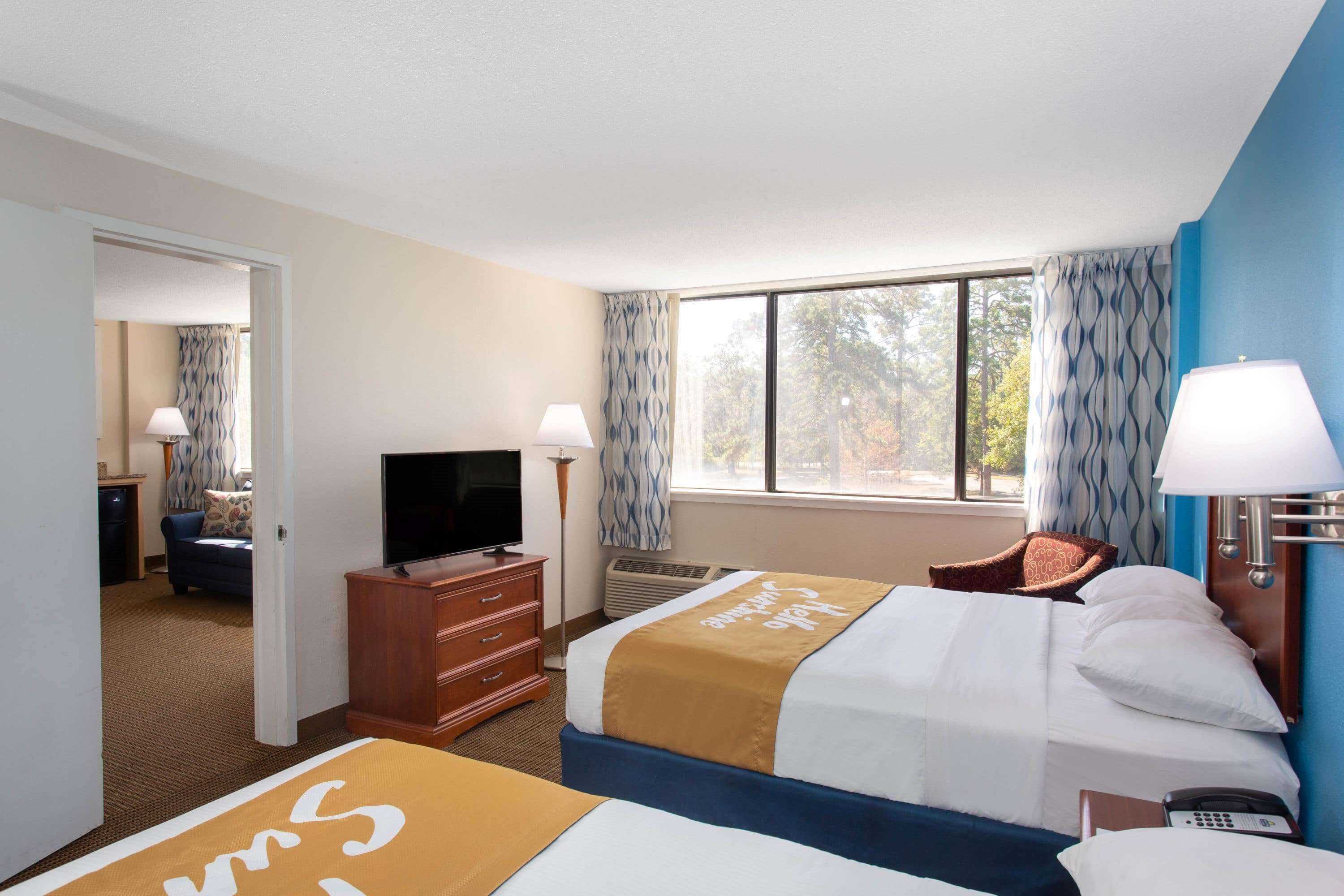 Suite, 2 Queen Beds, Non Smoking | Desk, iron/ironing board, free cribs/infant beds, rollaway beds