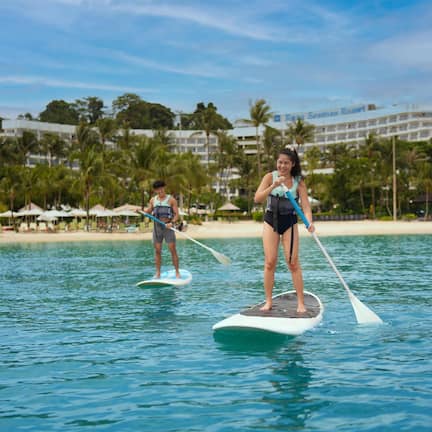 On the beach, sun loungers, beach towels, kayaking