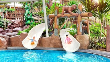 Enjoy water-based fun in our pool area with two slides surrounded by lush greenery and natural rock formations.