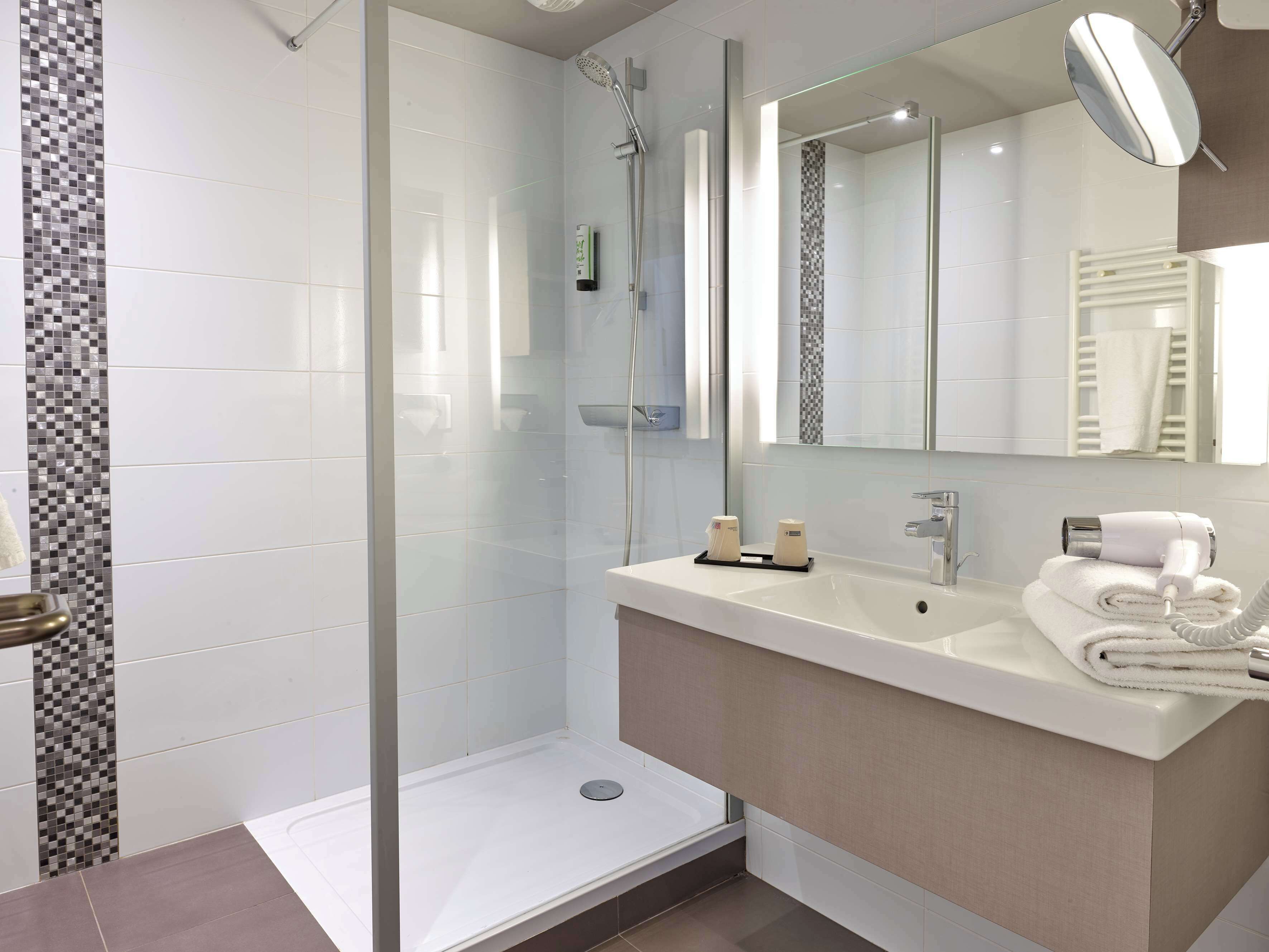 eco-friendly toiletries, hair dryer, towels, soap