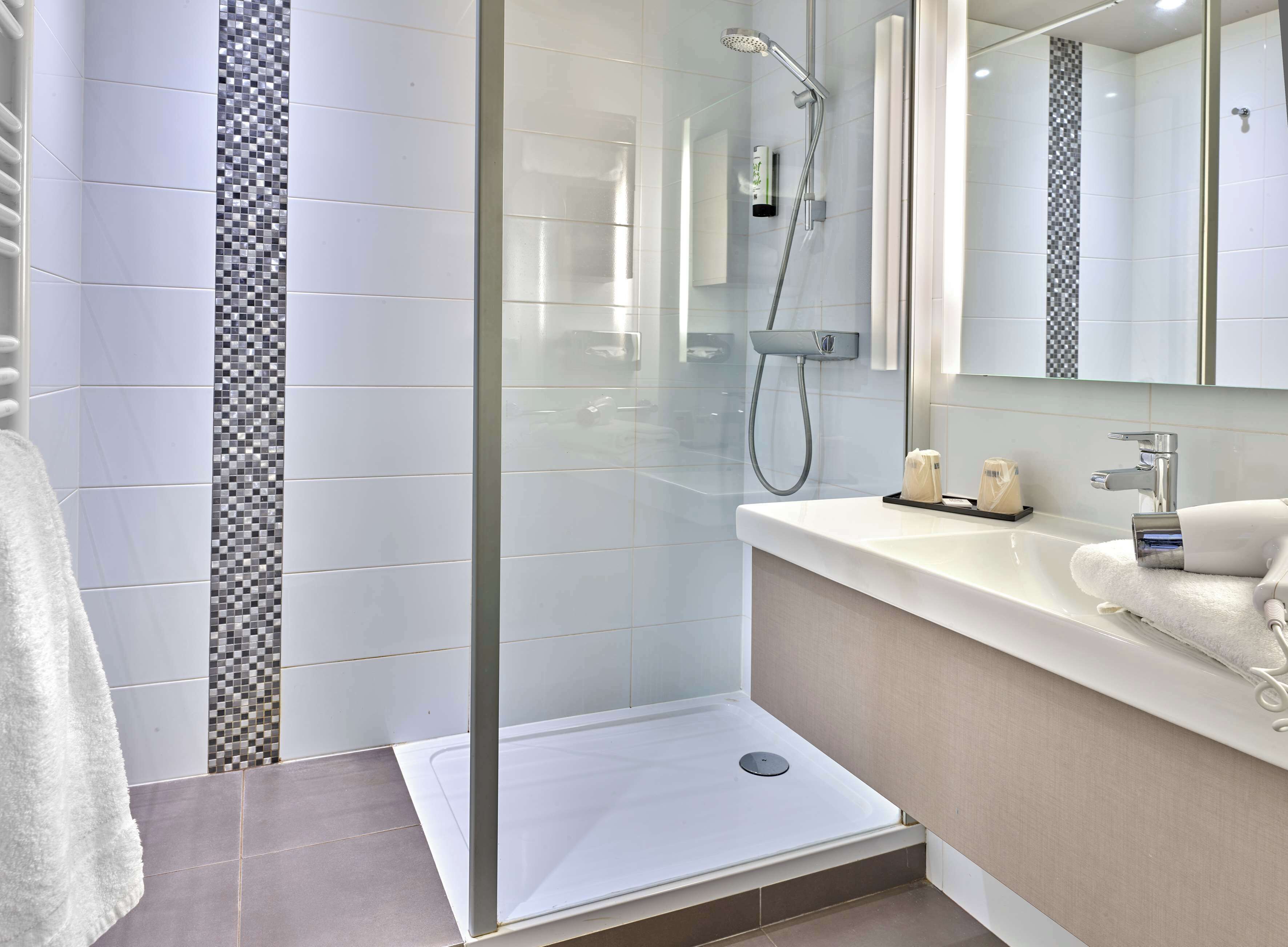 eco-friendly toiletries, hair dryer, towels, soap