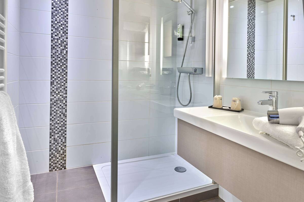 eco-friendly toiletries, hair dryer, towels, soap