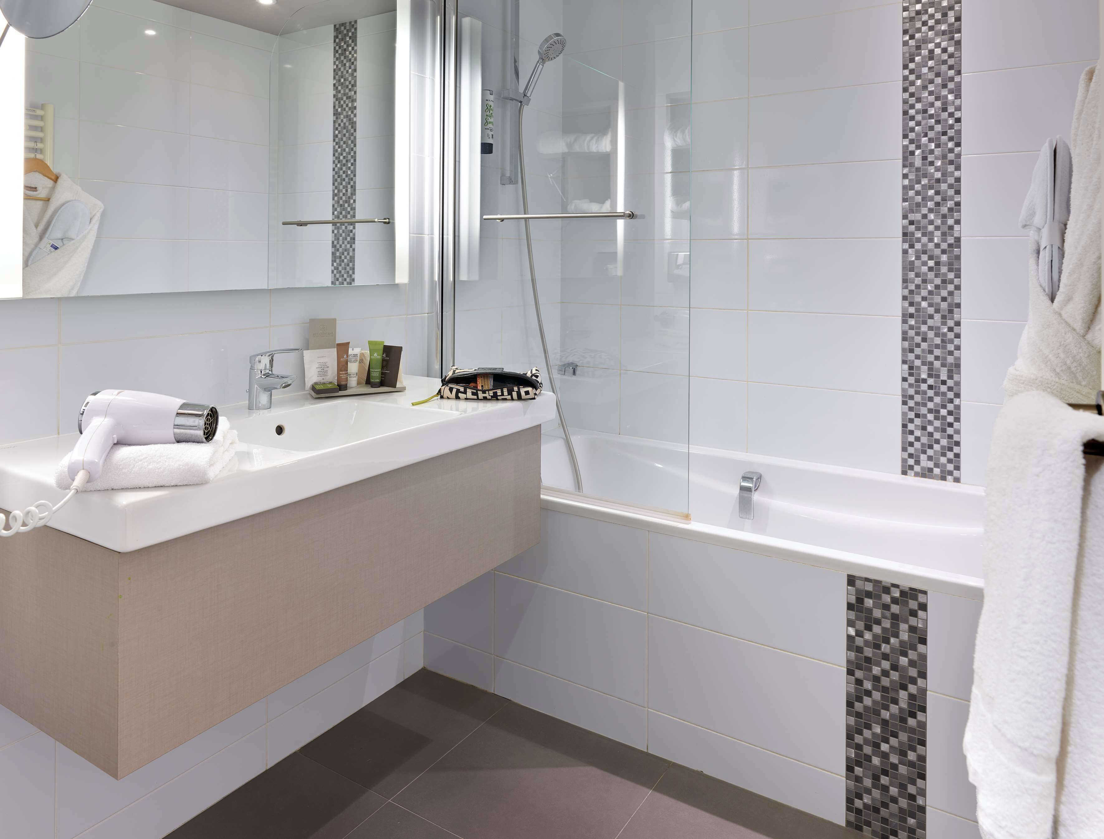 eco-friendly toiletries, hair dryer, towels, soap