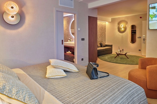 Junior Suite, 1 King Bed, Non Smoking (Larger Room;with Sofabed) | Premium bedding, in-room safe, laptop workspace, blackout drapes