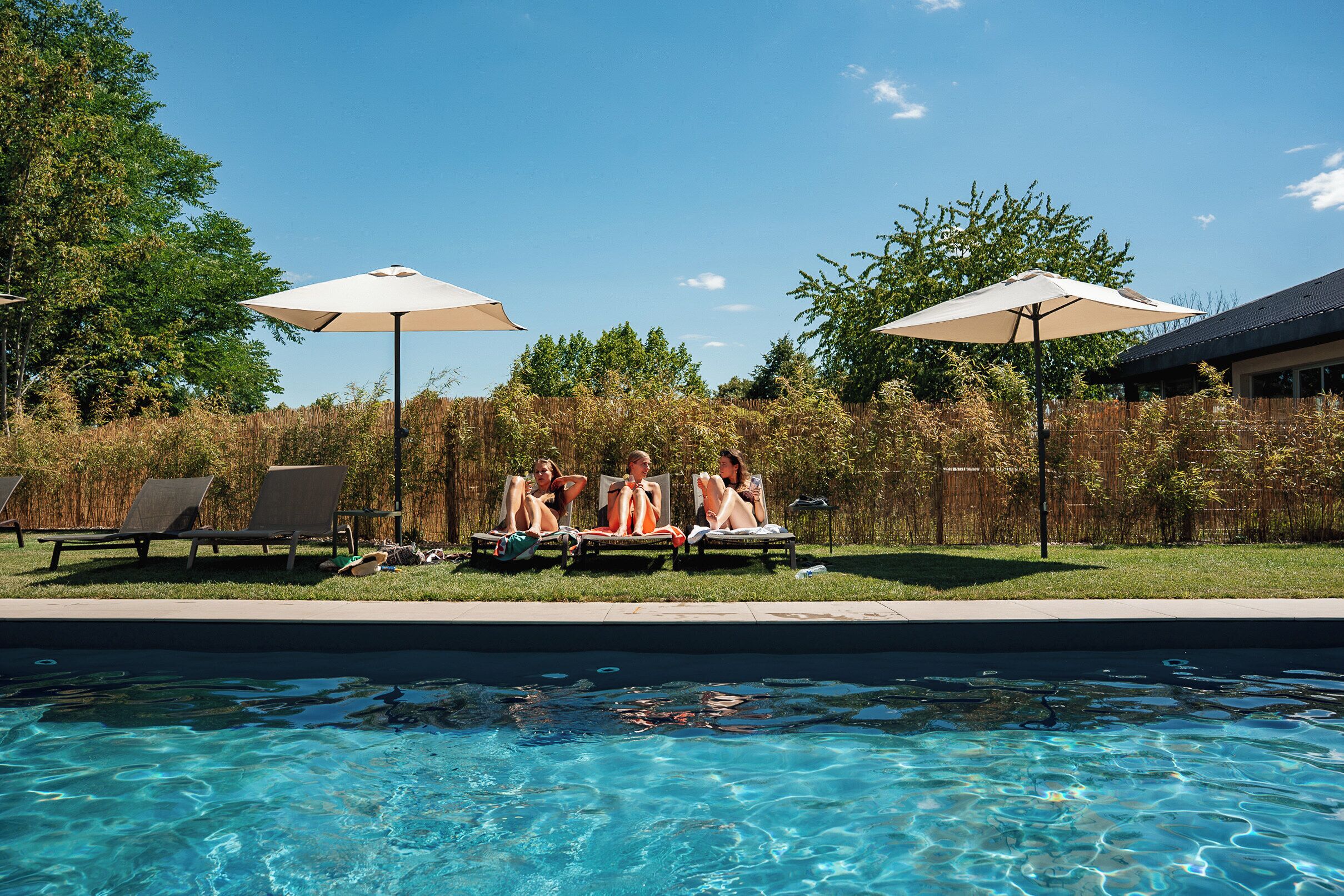 Seasonal outdoor pool, pool loungers