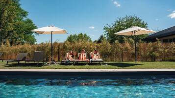 Seasonal outdoor pool, pool loungers