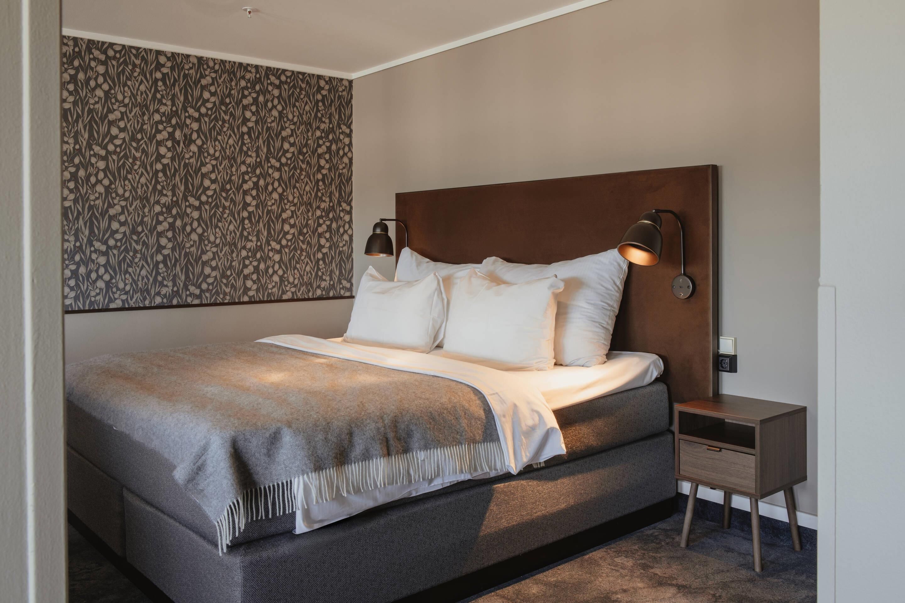 Desk, laptop workspace, blackout curtains, cots/infant beds