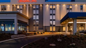 A Hampton Inn hotel with a modern facade, large windows, and a well-lit entrance. - Hampton Inn Asheville-Tunnel Rd. (Asheville)