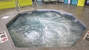 A hot tub with a tiled edge and a sign indicating a 3 ft depth. - Hampton Inn Asheville-Tunnel Rd. (Asheville)