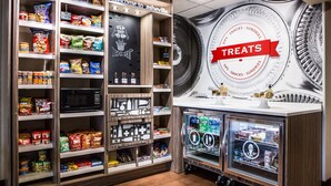 A treats display area with snacks and a refrigerated section. - Hampton Inn Asheville-Tunnel Rd. (Asheville)