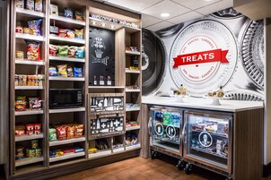 A treats display area with snacks and a refrigerated section.