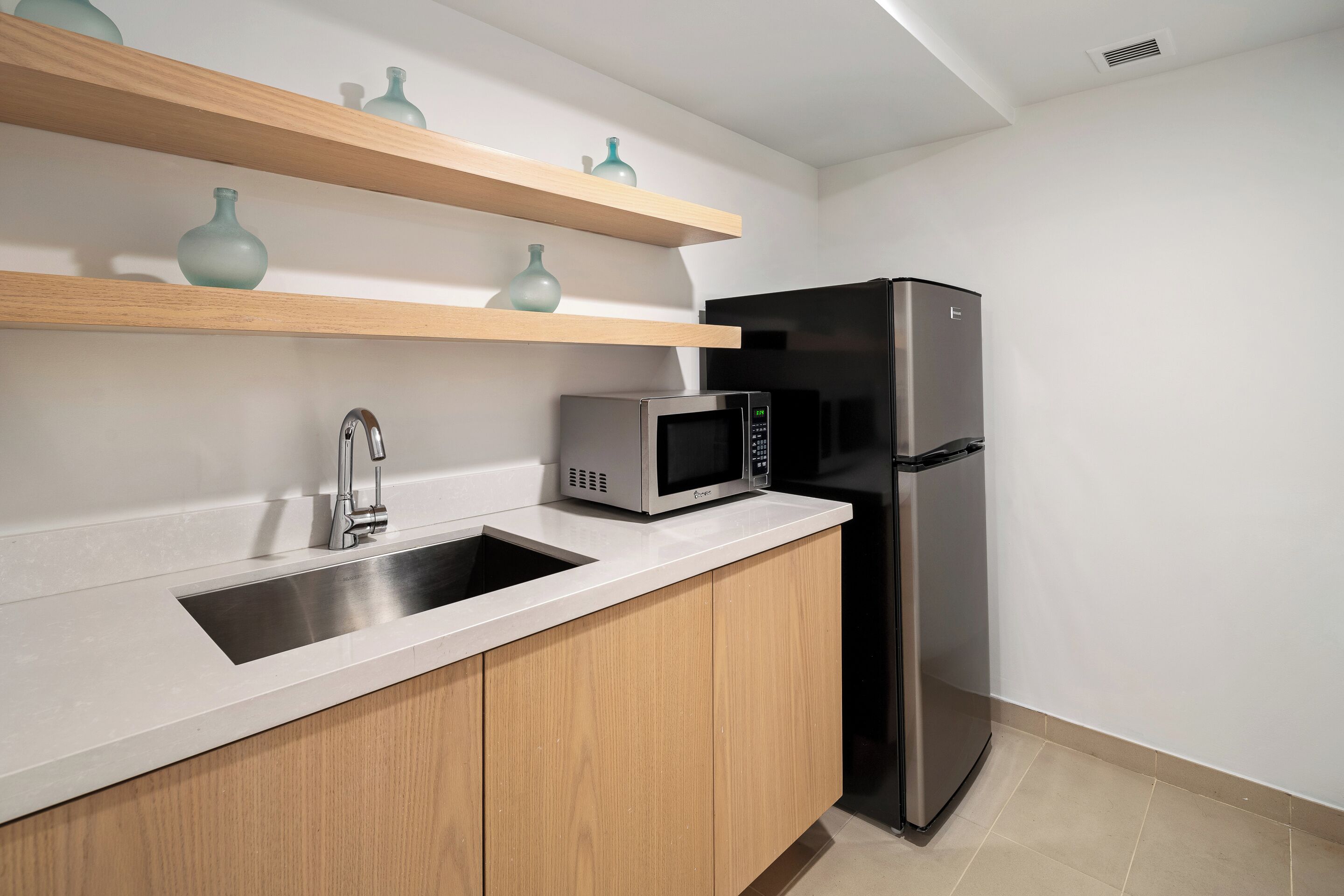 suite, 1 king bed, balcony, bay view | private kitchenette | espresso maker, coffee/tea maker, eco-friendly cleaning products