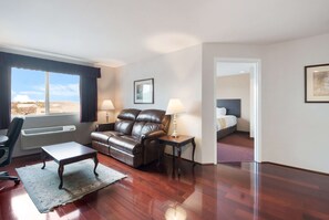 Premium bedding, desk, laptop workspace, iron/ironing board