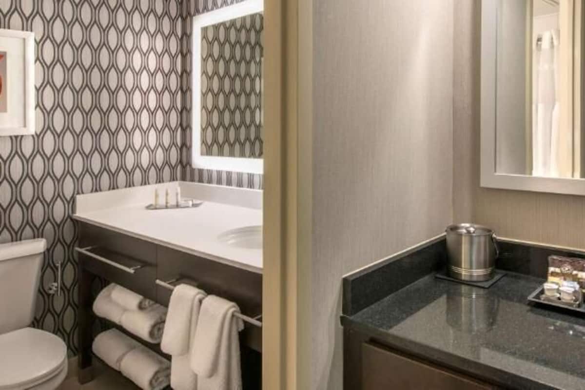 Combined shower/tub, designer toiletries, hair dryer, bathrobes