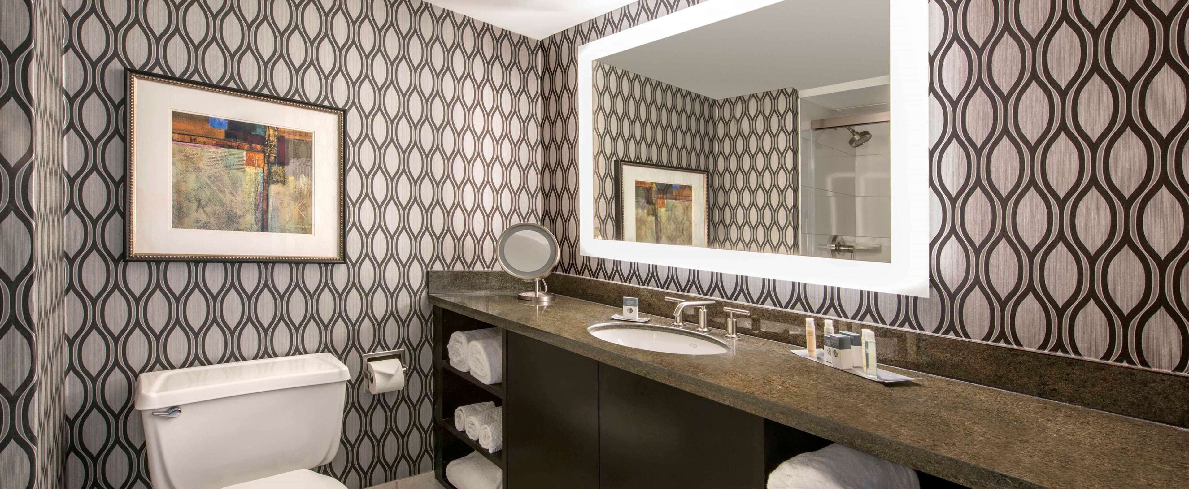 combined shower/bathtub, designer toiletries, hair dryer, bathrobes