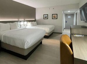 Hypo-allergenic bedding, desk, laptop workspace, blackout drapes