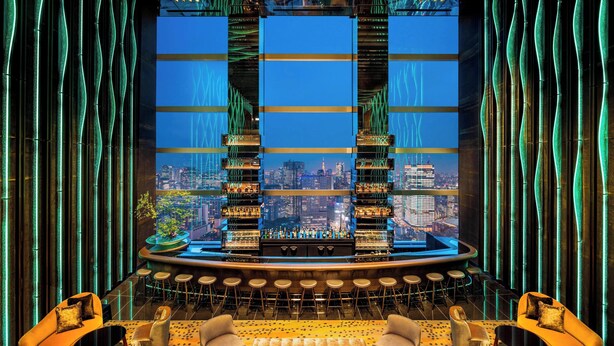 A bar area with a city view, modern furniture, and a large window with vertical blinds. - The Prince Gallery Tokyo Kioicho, a Luxury Collection Hotel (Tokyo)