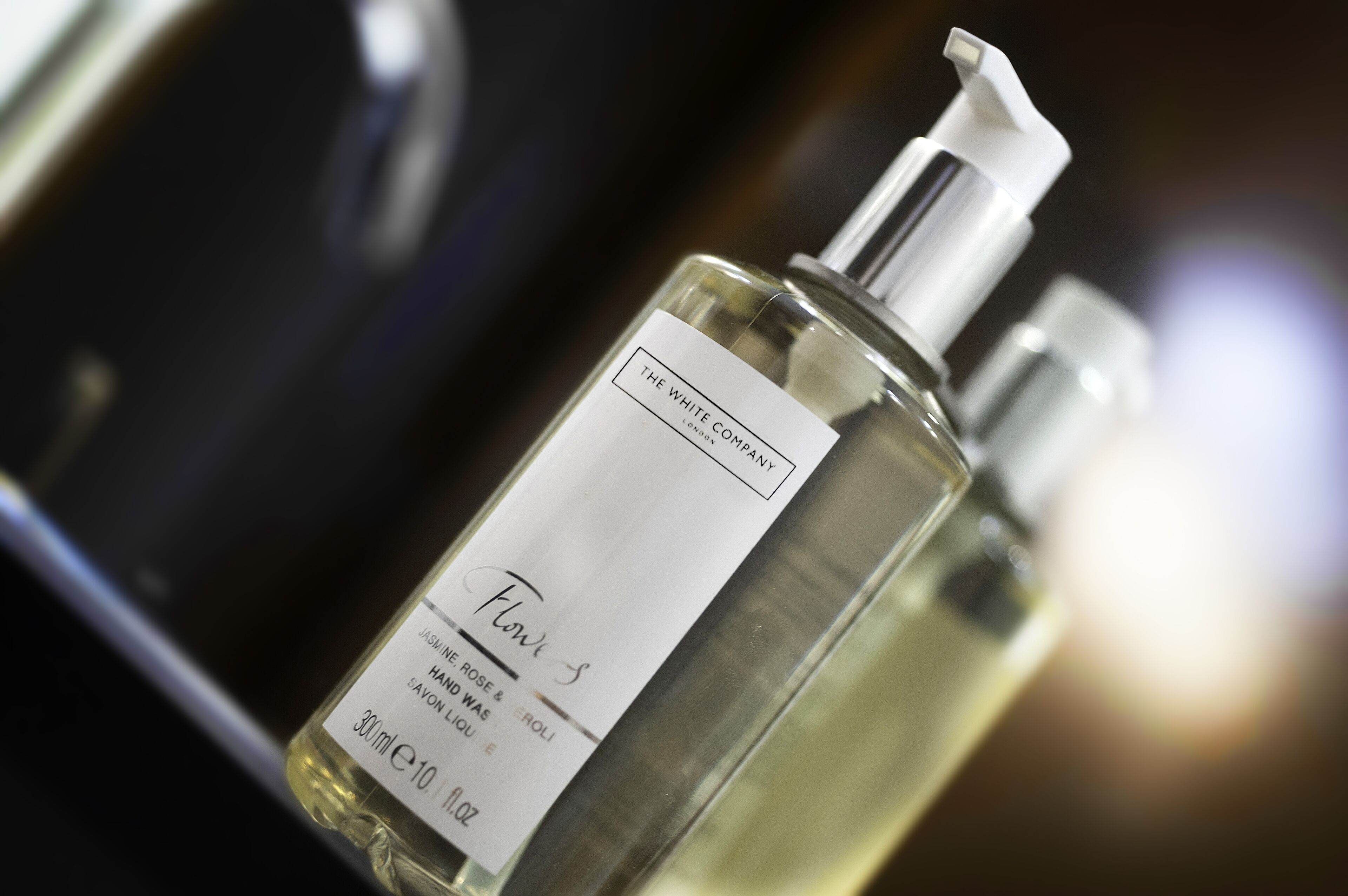 deep-soaking bathtub, rainfall showerhead, designer toiletries