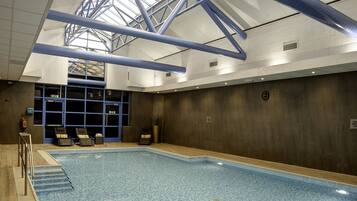Indoor pool, open 7:00 AM to 9:00 PM, pool loungers
