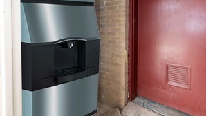 A stainless steel refrigerator with a water dispenser and a red door. - Red Roof Inn Petersburg - Fort Lee (Petersburg)