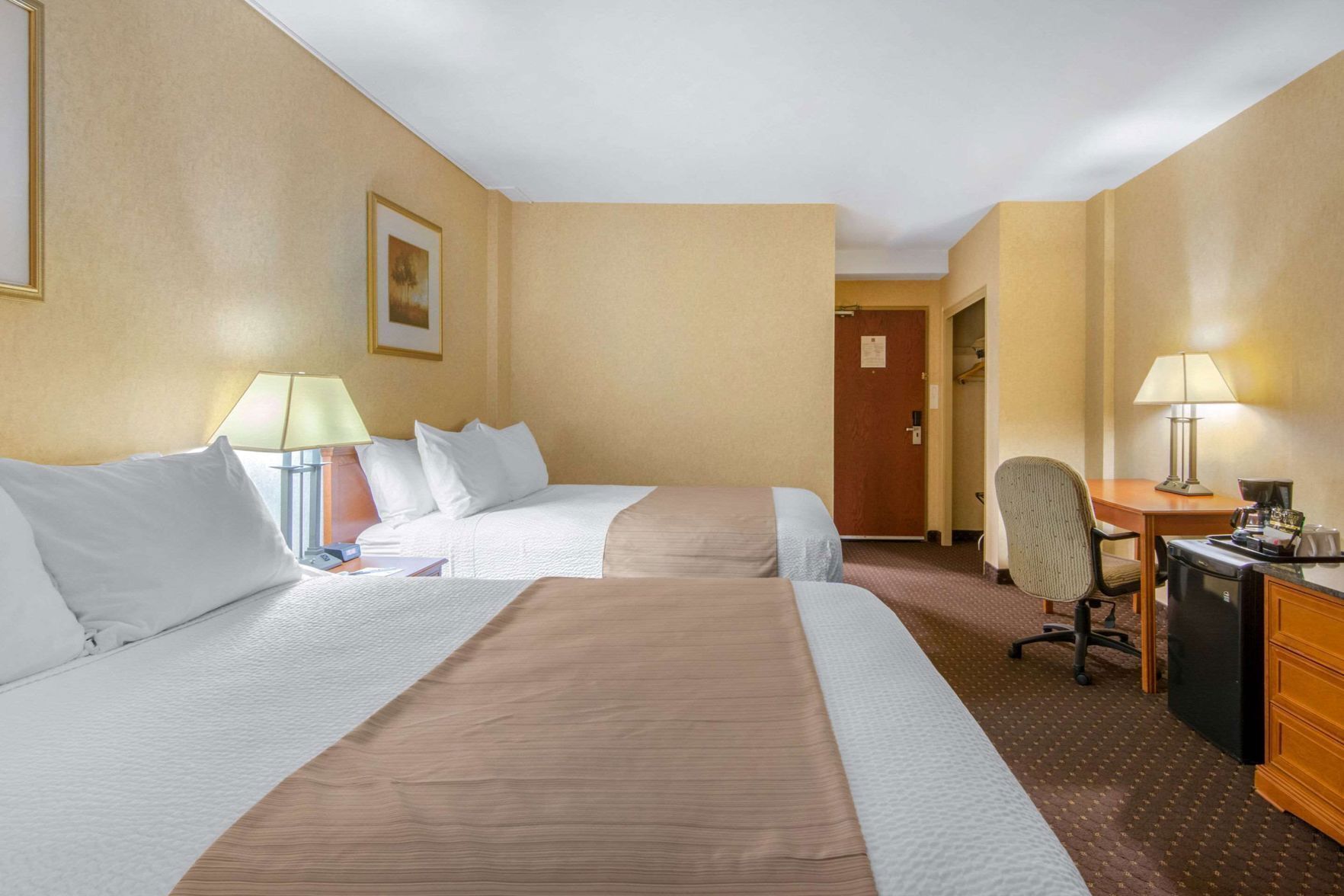 Pillowtop beds, desk, blackout drapes, iron/ironing board