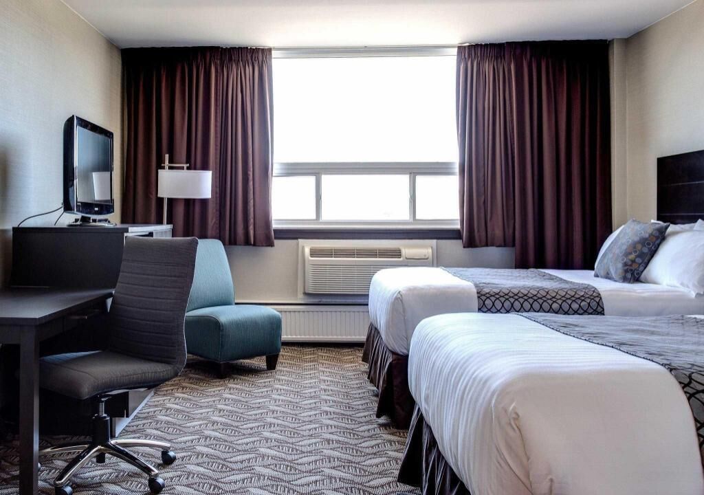 Pillowtop beds, desk, blackout drapes, iron/ironing board