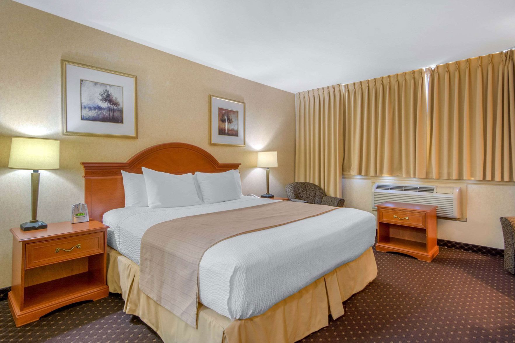 Pillowtop beds, desk, blackout drapes, iron/ironing board