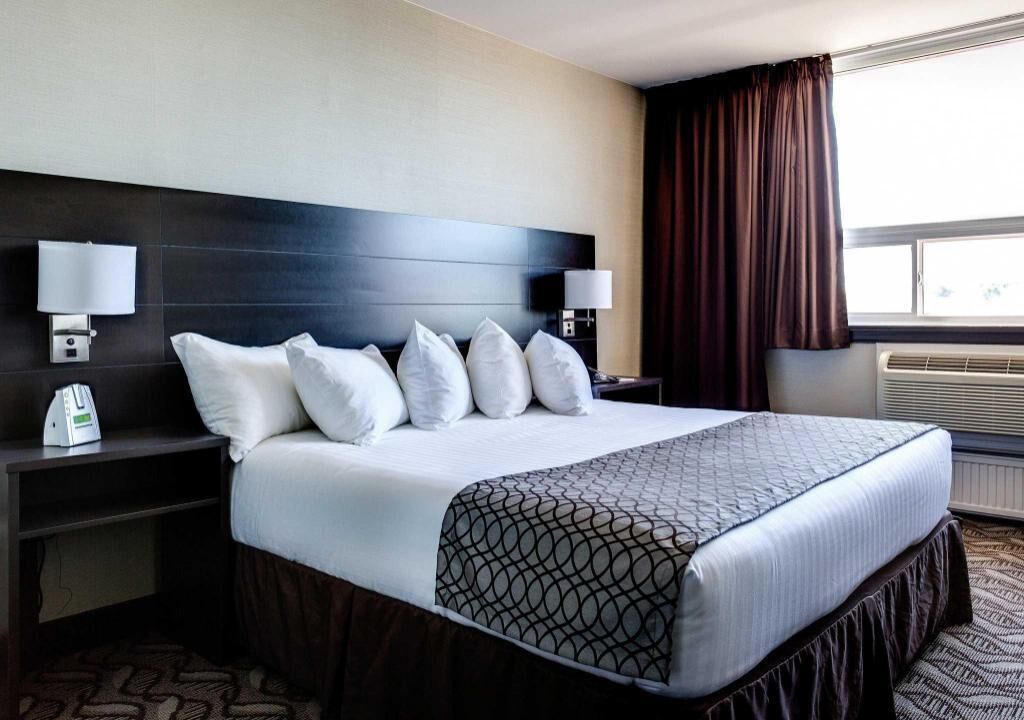 Pillowtop beds, desk, blackout drapes, iron/ironing board