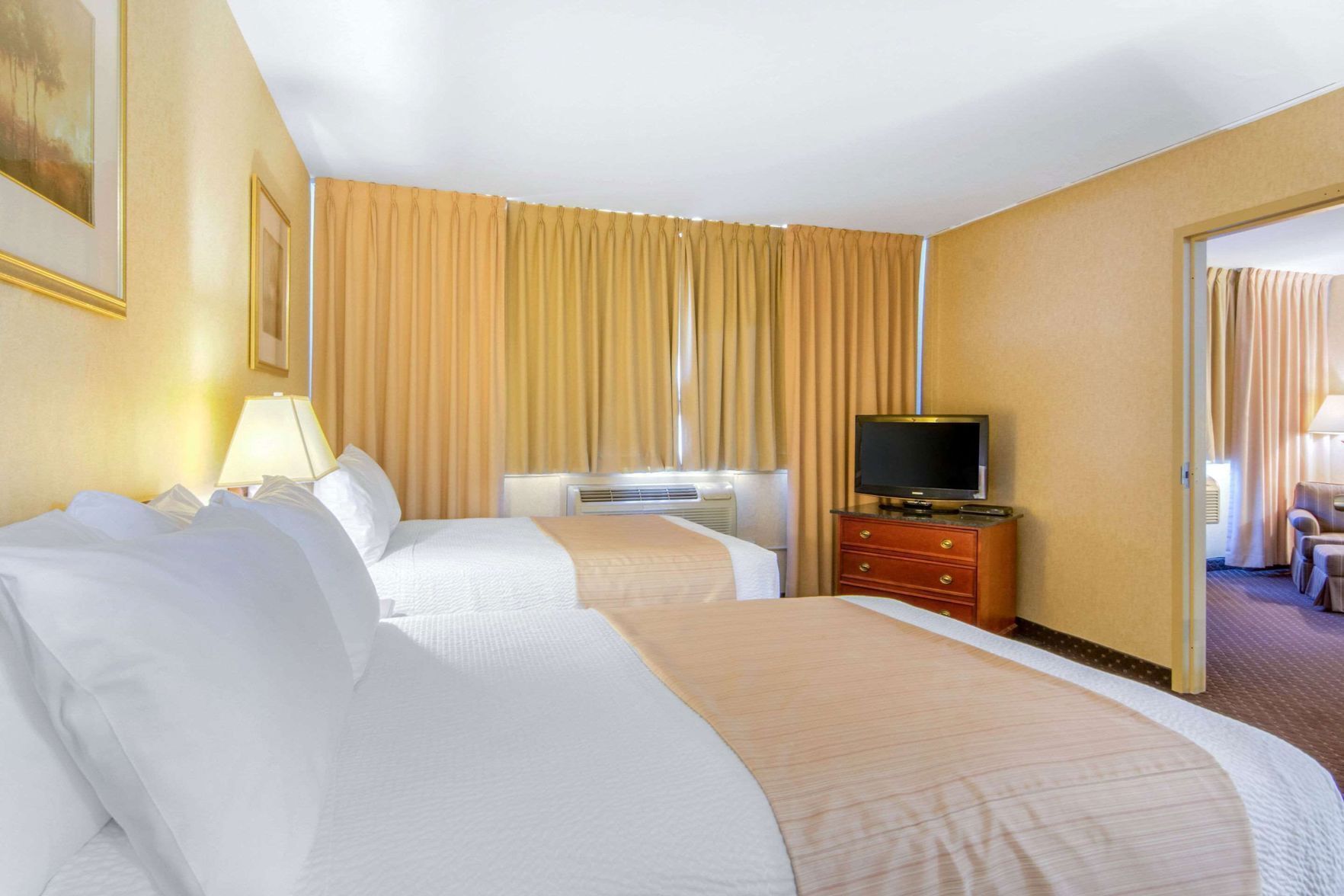 Pillowtop beds, desk, blackout drapes, iron/ironing board