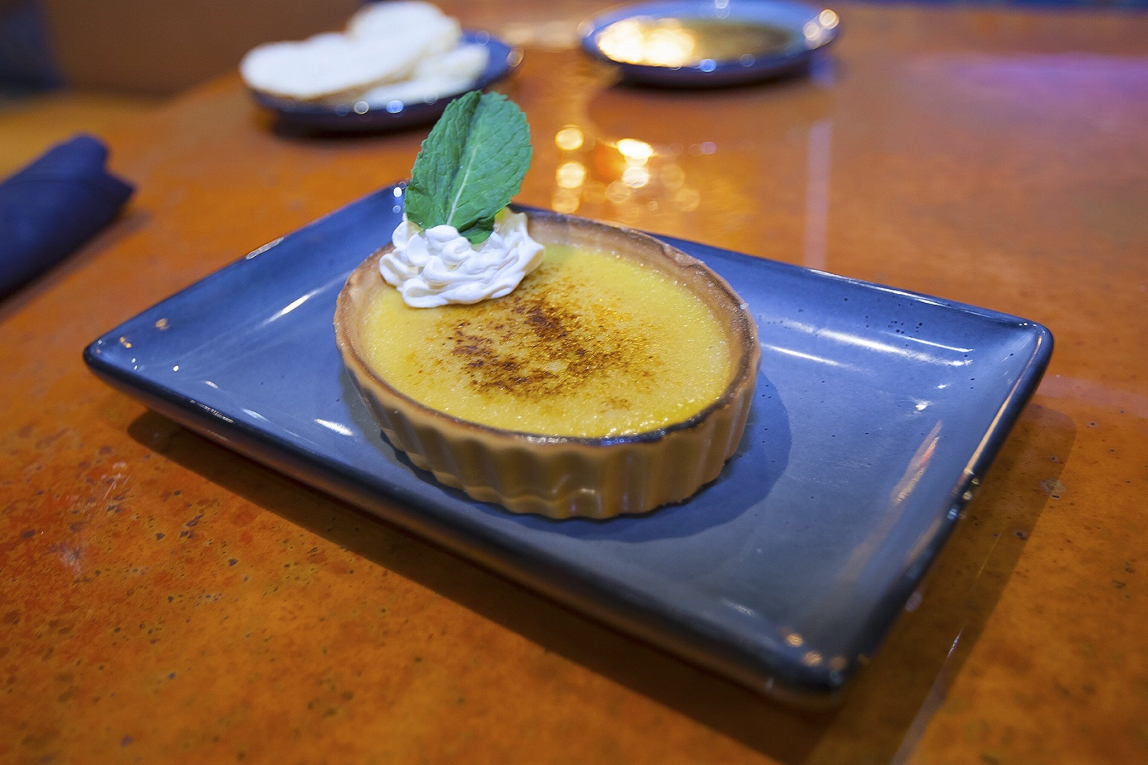 A dessert on a blue plate.
