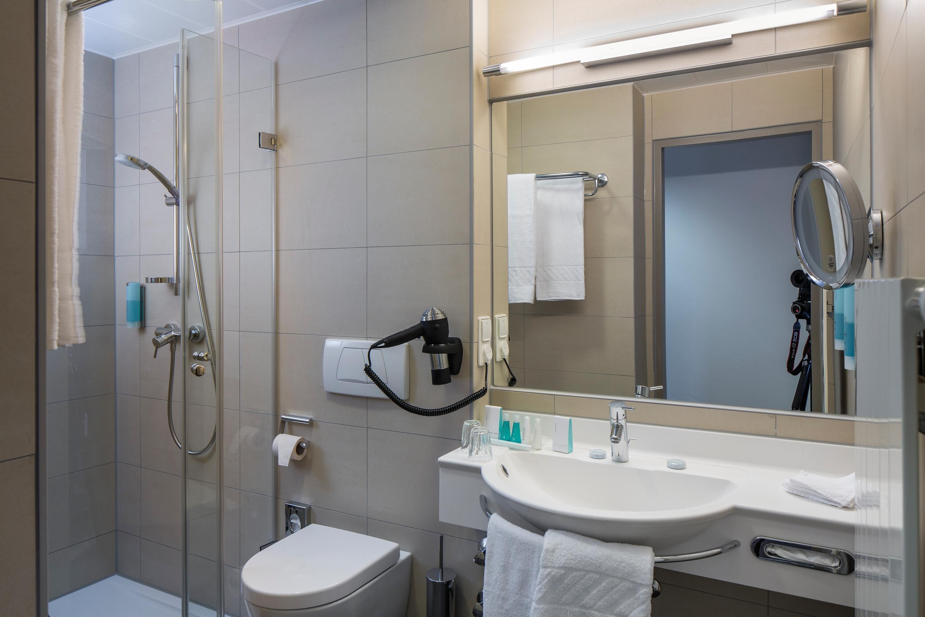 superior room | bathroom | eco-friendly toiletries, hair dryer, towels