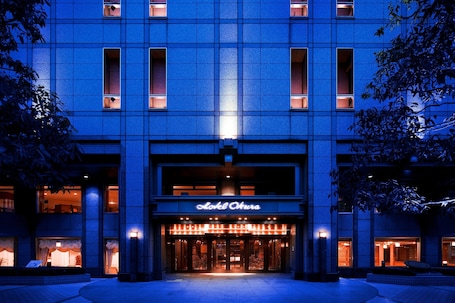 A hotel entrance with a sign reading "Hotel Ohura."