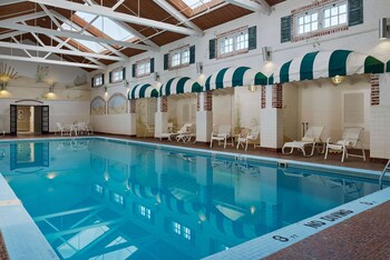 Indoor pool, seasonal outdoor pool, pool umbrellas, sun loungers at Seaview, A Dolce Hotel
