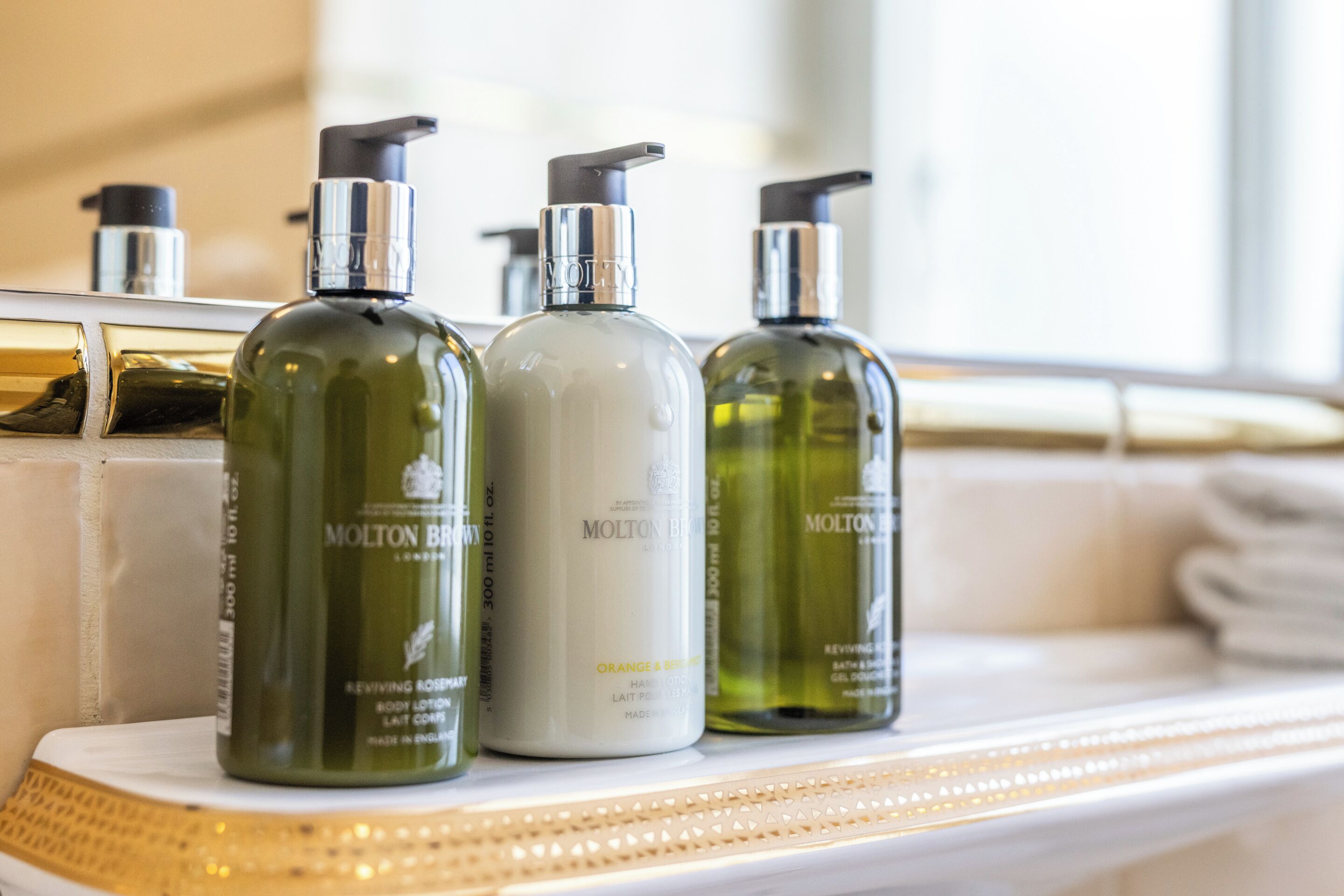 designer toiletries, hair dryer, bathrobes, heated floors