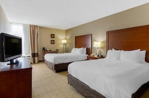 A hotel room with two beds, a desk, a television, and a lamp. - Comfort Inn Blacksburg University Area (Christiansburg)