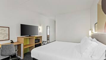 Premium bedding, desk, laptop workspace, iron/ironing board