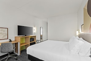 Premium bedding, desk, laptop workspace, iron/ironing board