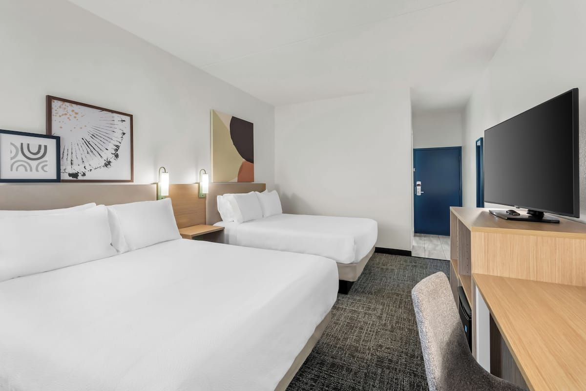 Premium bedding, desk, laptop workspace, iron/ironing board