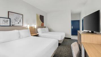 Premium bedding, desk, laptop workspace, iron/ironing board