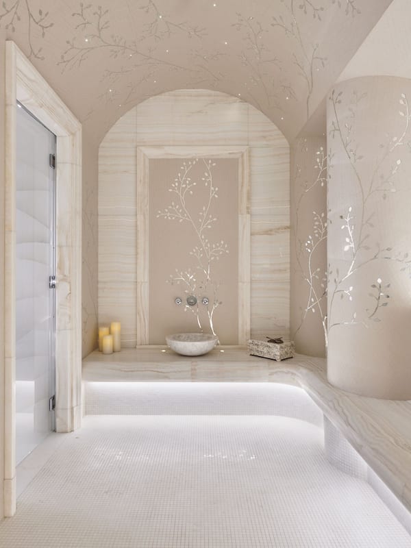 Bathroom features a bathtub, glass shower enclosure, and a small sink.