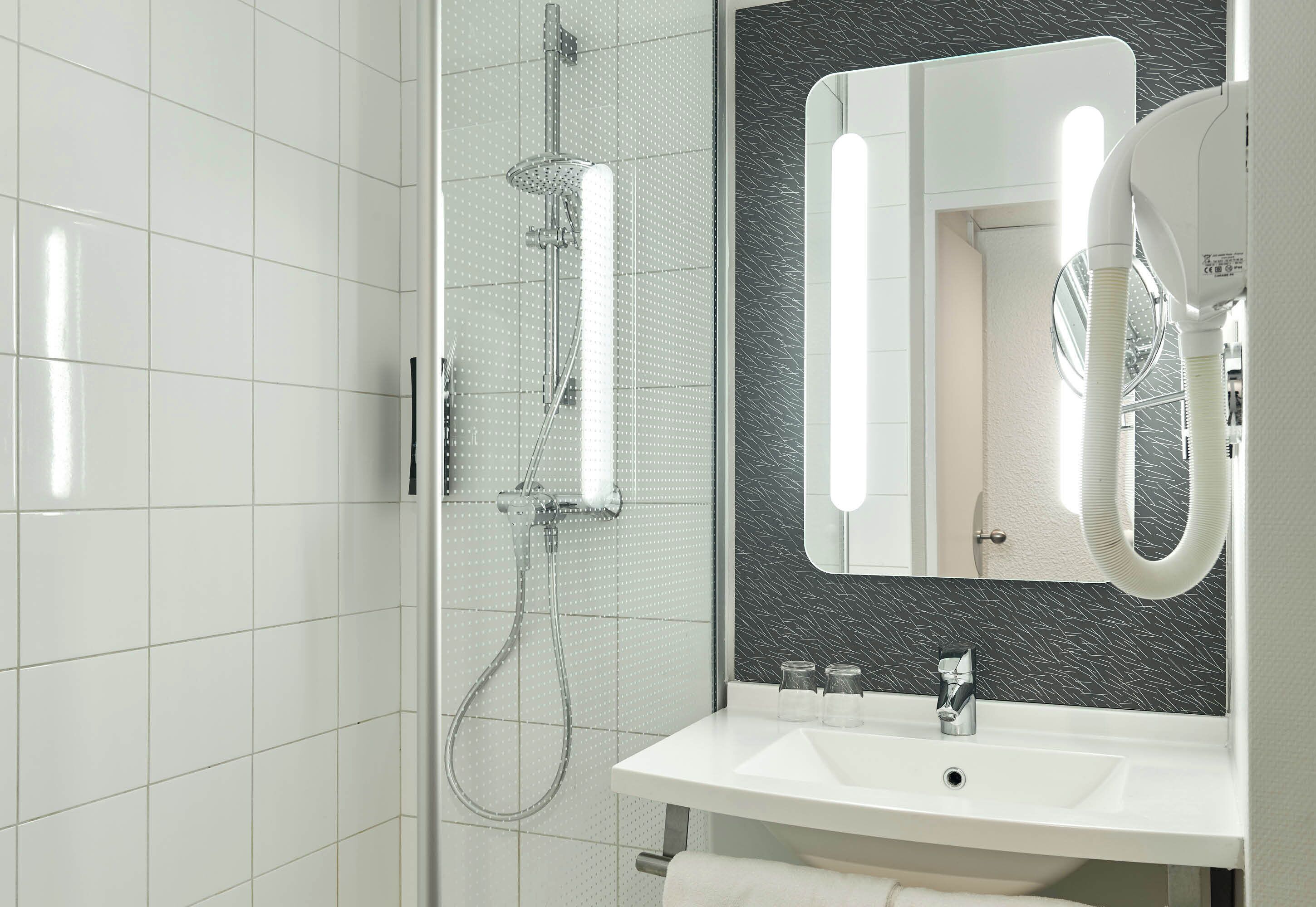 Shower, eco-friendly toiletries, hair dryer, towels