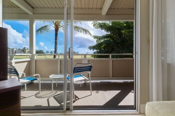 In-room safe, desk, laptop workspace, blackout drapes at Plantation Hale Suites