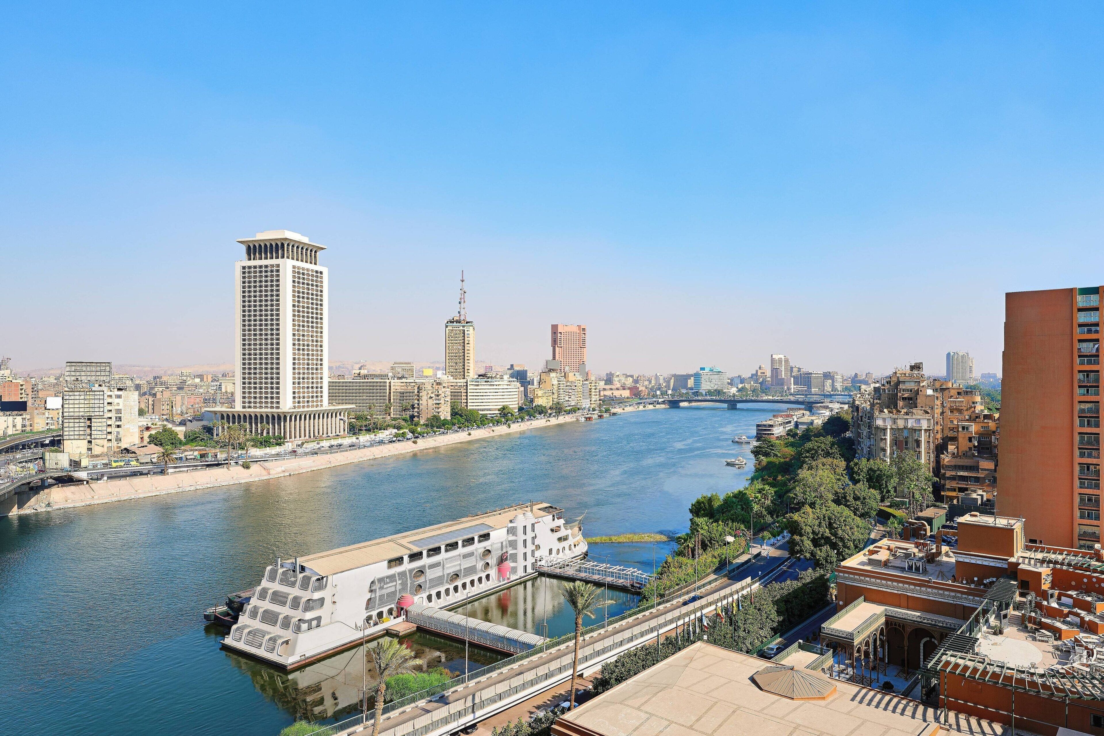 A river with a bridge and buildings along the riverbank.