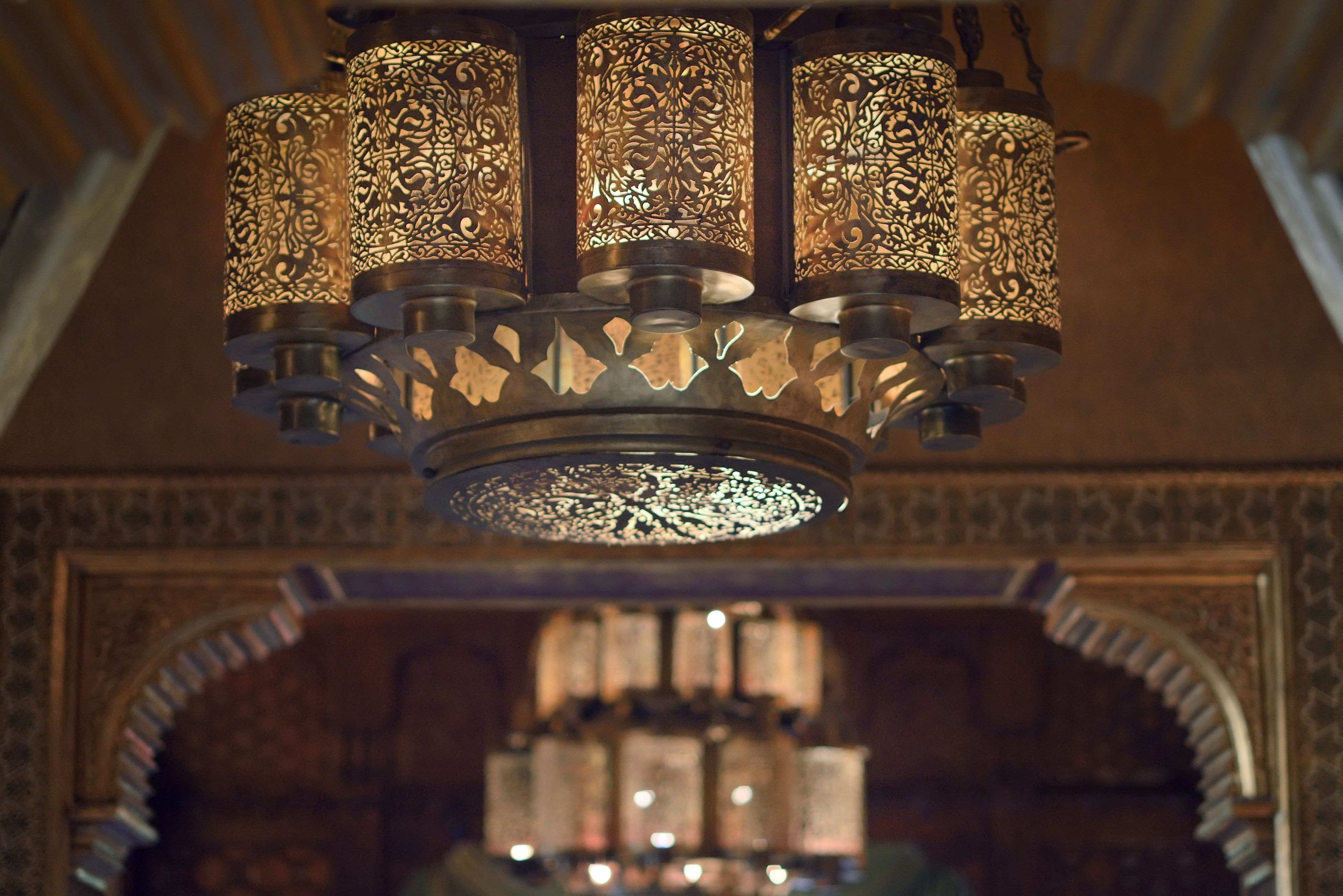 A chandelier with intricate metalwork and multiple light sources.