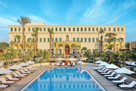 Outdoor pool, open 7:00 AM to 6:30 PM, pool umbrellas, pool loungers. Cairo Marriott Hotel